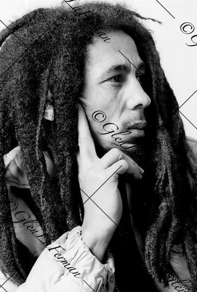 Photograph and Print of Bob Marley hand on chin, thinking