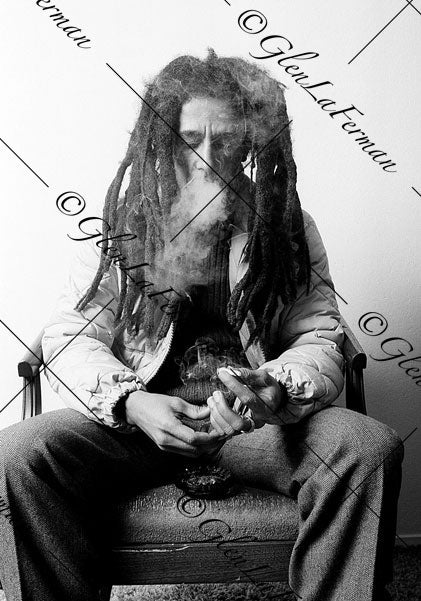 Photograph and Print of Bob Marley smoking, exhaling smoke 