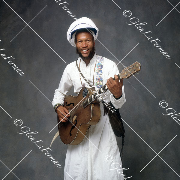 <p>Harry Perry in white with guitar in hand</p> <p> </p>