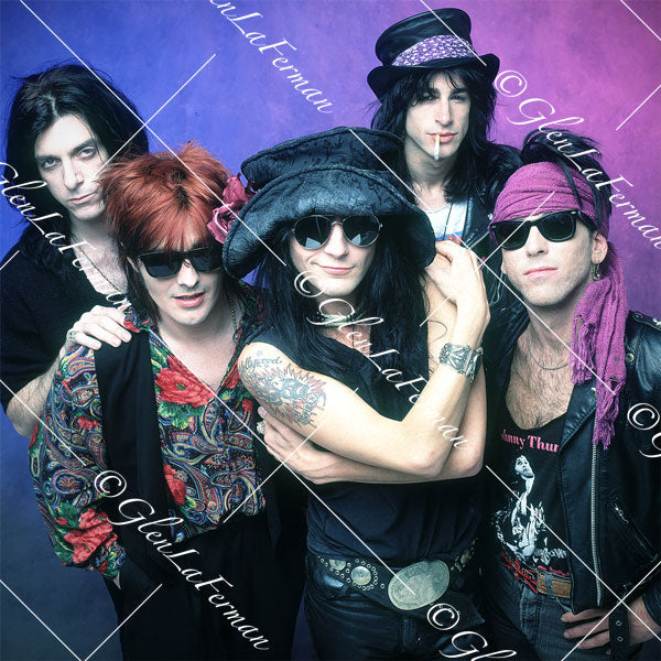 L.A. Guns up close, shades on, colorful drop