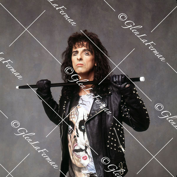 Alice Cooper with leather jacket and baton