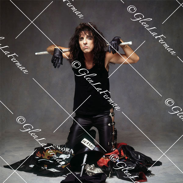 Alice Cooper with baton and other props