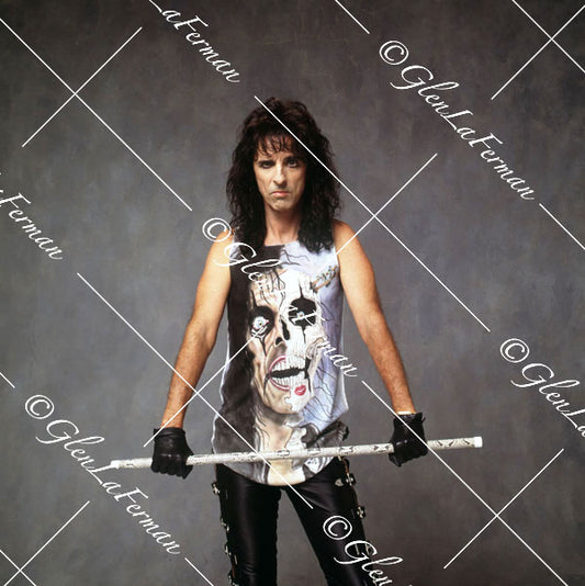 Alice Cooper standing with white baton