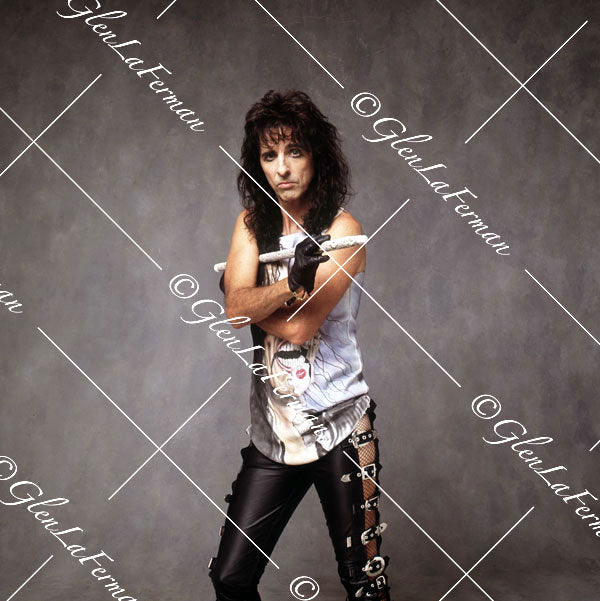 Alice Cooper cradling white baton