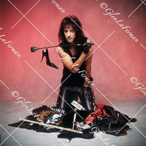 Photograph and Print of Alice Cooper with club and other props