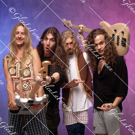 Alice in Chains with guitars, pointing fingers