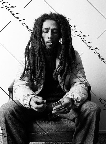 Photograph and Print of Bob Marley striking match