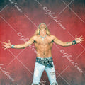 Brett Michaels standing shirtless with arms outstretched