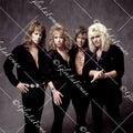 Dokken standing in all black button up shirts