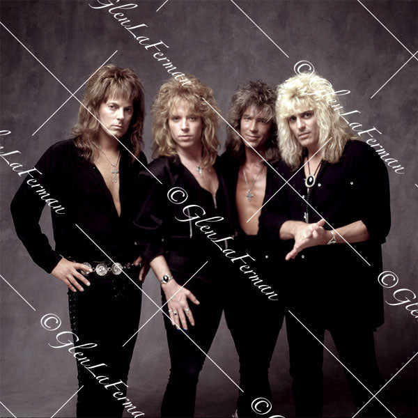 Dokken standing in all black button up shirts