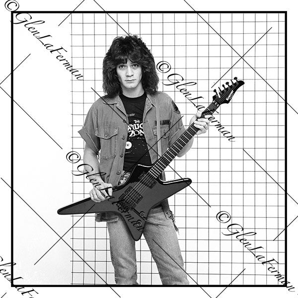 A Photograph and Print of Eddie Van Halen with black guitar