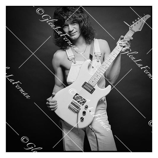 A Print and Photograph of Eddie Van Halen in overalls with guitar