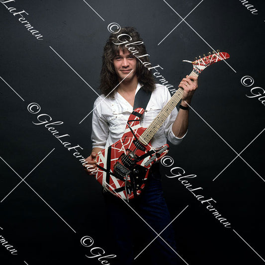 A Print and Photograph of Eddie Van Halen in white button up with Kramer Frankenstrat