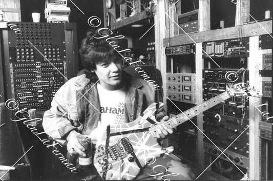 A Print and Photograph of Eddie Van Halen in studio with Kramer Frankenstrat