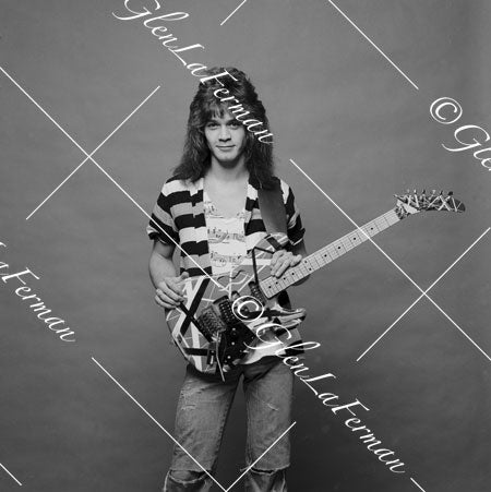 A Print and Photograph of Eddie Van Halen standing with Kramer Frankenstrat