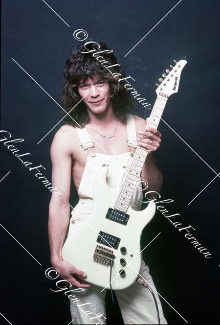 A Print and Photograph of Eddie Van Halen in overalls looking out with Kramer Frankenstrat