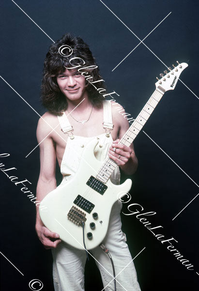 A Print and Photograph of Eddie Van Halen in overalls looking out with Kramer Frankenstrat