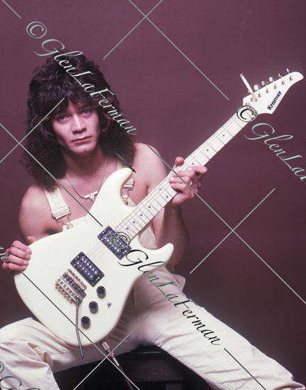 A Print and Photograph of Eddie Van Halen in overalls on stool with Kramer Frankenstrat