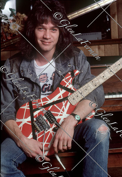 Eddie Van Halen in home studio smiling with Kramer Frankenstrat