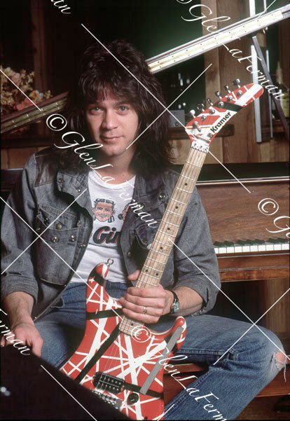 Eddie Van Halen in home studio by piano with Kramer Frankenstrat