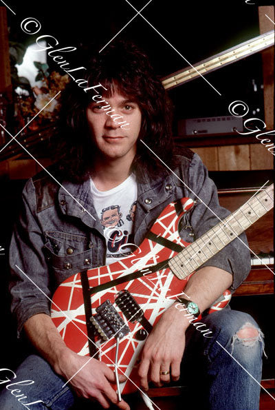 Eddie Van Halen in home studio by piano with Kramer Frankenstrat