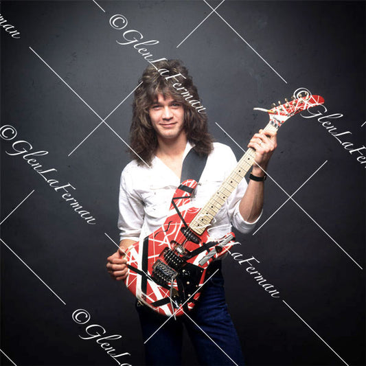 Eddie Van Halen in white button up shirt with Kramer Frankenstrat