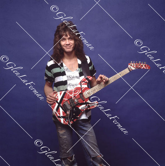 Eddie Van Halen in jeans with cigarette and Kramer Frankenstrat