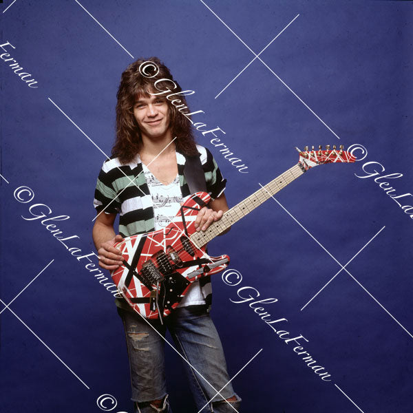 Eddie Van Halen in jeans and Kramer Frankenstrat smiling