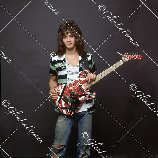 Eddie Van Halen in striped shirt and Kramer Frankenstrat