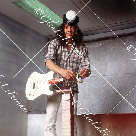 Eddie Van Halen in flannel shirt and hat