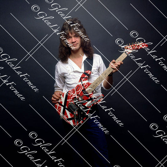 Eddie Van Halen in button up white shirt with red Frankenstrat