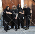 Fear Factory in all black with sunglasses standing
