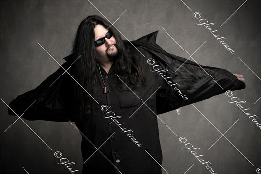 Fear Factory in all black with sunglasses, solo wingspan