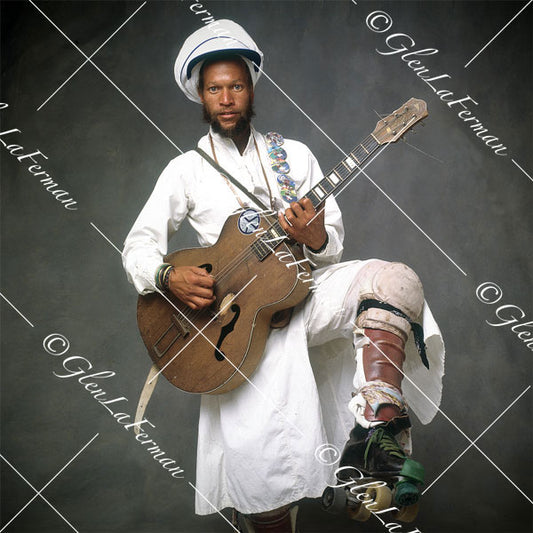 Harry Perry in white with guitar