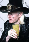 Johnny Winter close up with hat and drink