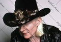 Johnny Winter close up with hat looking down