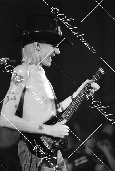 Johnny Winter live close up, shirtless