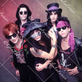 L.A. Guns close up, arms crossed, colorful drop