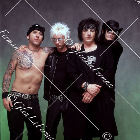 L.A. Guns as a group, shirtless, grey and green drop