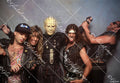 Fear Factory together smiling, one with gold mask