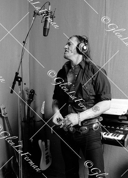 Lemmy Kilmister in studio with mic, eyes closed