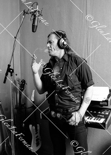 Lemmy Kilmister in studio with mic, smoking