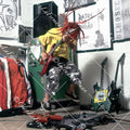 Max Cavalera in studio, jumping with Schecter