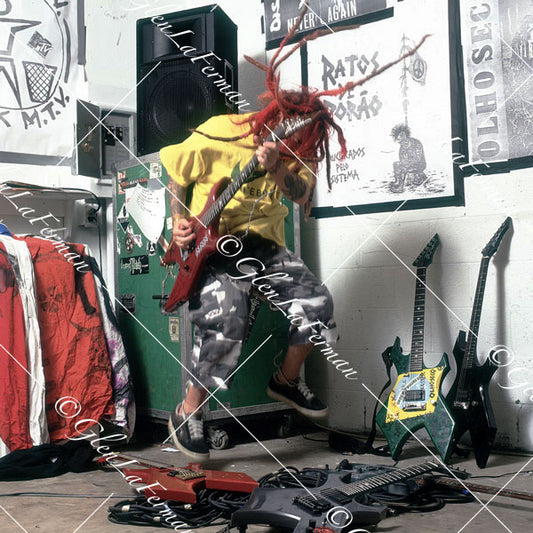 Max Cavalera in studio, jumping with Schecter