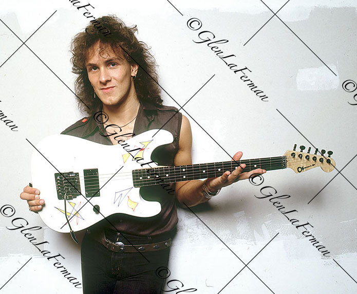 Vivian Campbell in black with white Charvel