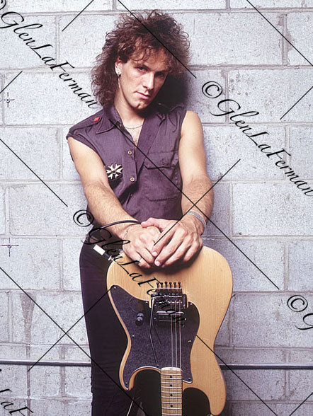 Vivian Campbell with white brick