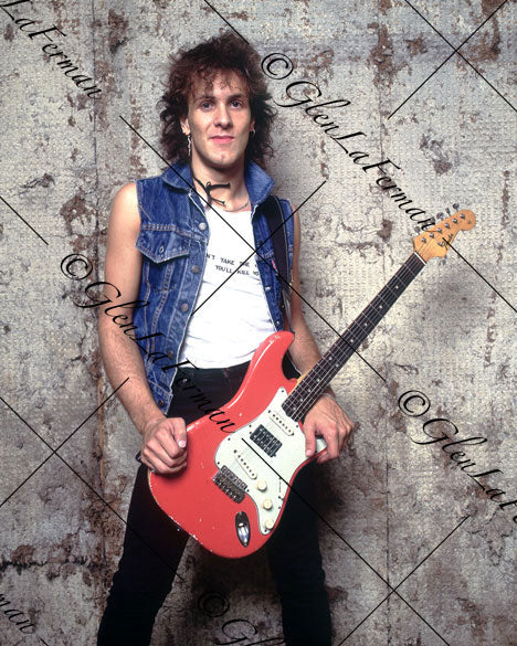 Vivian Campbell in jean button up with red Fender