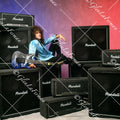 Vivian Campbell in studio leaning back on amps