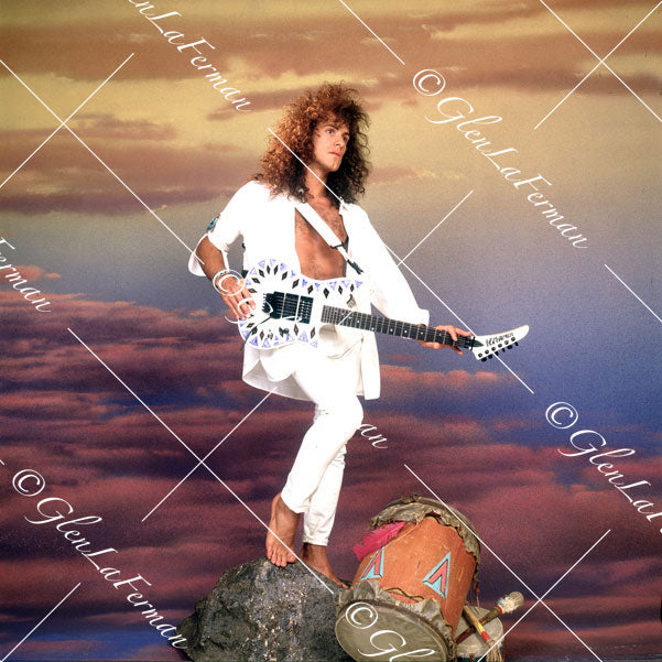 Vivian Campbell in white with Kramer Frankenstrat and sunset